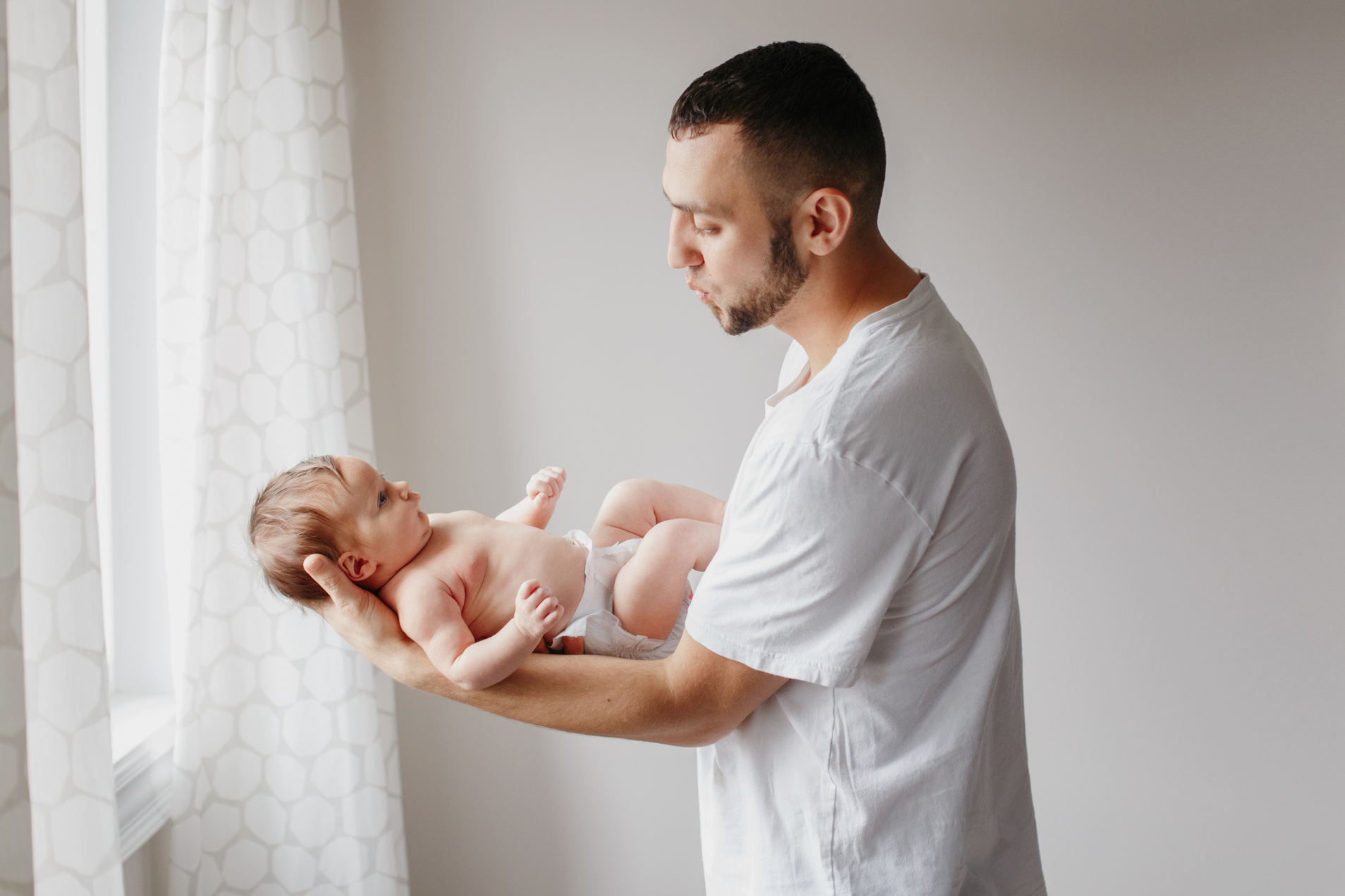 Father Carrying His Baby           